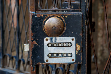 Fototapeta na wymiar Wooden Doorknob of Iron Door