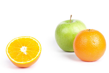 Fototapeta na wymiar Oranges and green apple on white