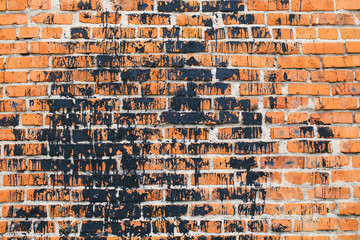 vandalism. drenched in black paint bricks walls building