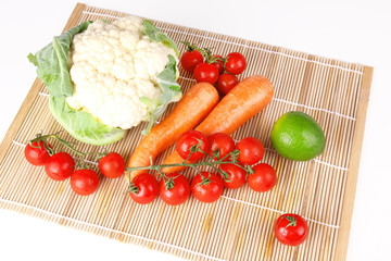 Fresh vegetables on wooden mat