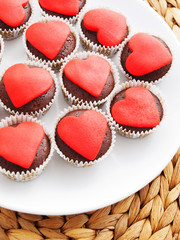 Chocolate muffins with red heart on top