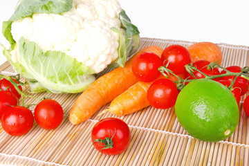 Raw vegetables on wooden mat