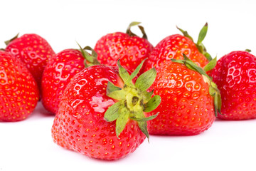 Red strawberries on white