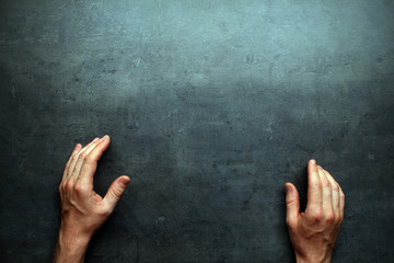 Man hands on grey table background with space for text