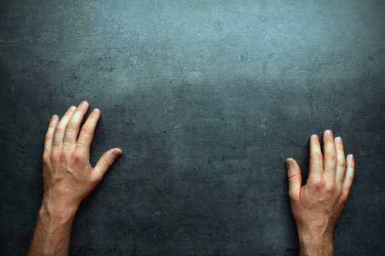 Man hands on grey table background