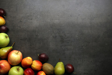 Fresh fruits on table with copyspace, top view