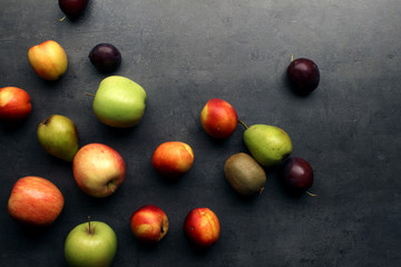 Fresh fruits on grey kitchen table
