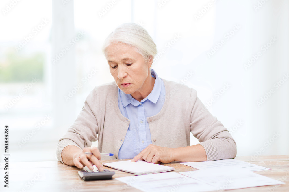 Sticker senior woman with papers and calculator at home