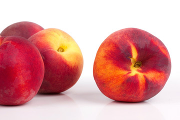 Peaches on white table