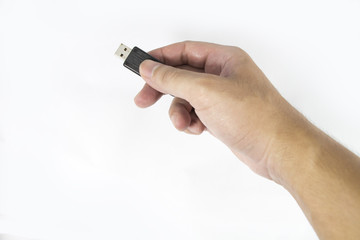 hand holding flash drive isolated on white background