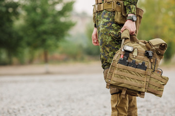 yang soldier  holding their equipment