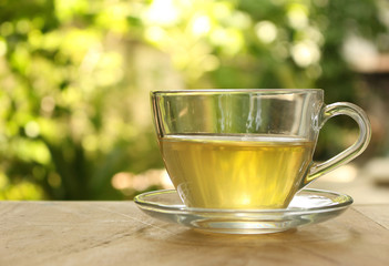 Cup of tea on a blurred background of nature.