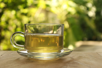 Cup of tea on a blurred background of nature.