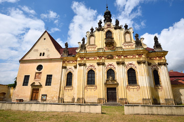 Fototapeta na wymiar Old baroque church with statues of the saints