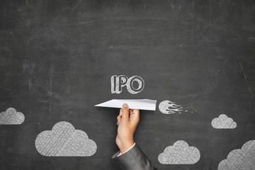 IPO concept on blackboard with paper plane