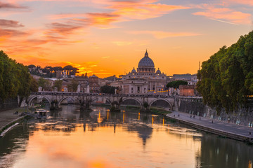 Fototapeta na wymiar Sunset view of Basilica St Peter and river Tiber in Rome. Italy 