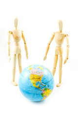 Dummy wooden with world map on white background