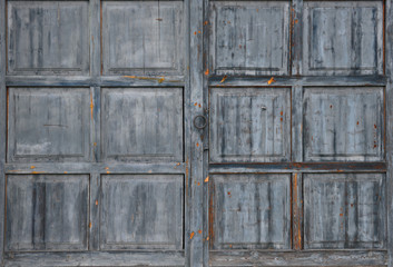 Old weathered large grey wooden gate texture