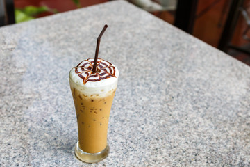 Ice coffee on table in cafe