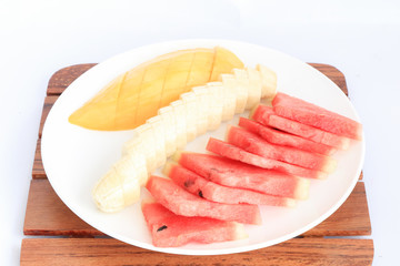 slice fruits (bananas and watermelon) put on plate