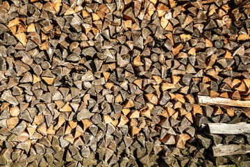 Background of dry chopped firewood logs