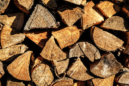 Background of dry chopped firewood logs
