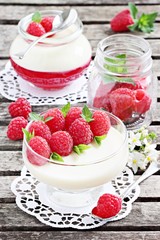 Panna cotta with fresh raspberries. Selective focus.