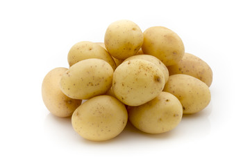 Potatoes on the white background.  New harvest.