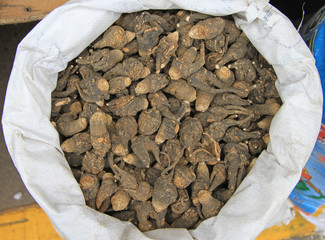 sack with roots of ginseng on the market in Lijiang
