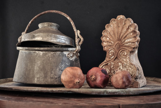 old copper pot. cooker, bowl and pomegranate fruit
