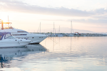 Boats docked in harbor at dusk. Thassos Greece