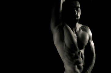 Fototapeta na wymiar Showing abdominal muscles in gym