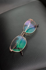 Polarized Glasses on Leather Background