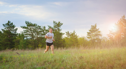 Young man jogging outdoors.