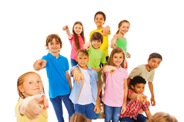 Large group of cute kids pointing at camera 