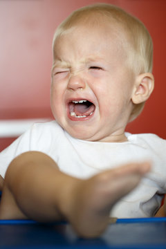 Small, Crying And Raging Toddler Having A Temper Tantrum