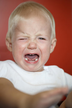 Small, Crying Toddler In Pain After Falling Down