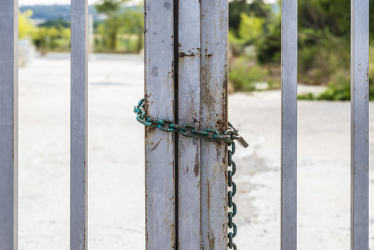 Fence closed with a chain and a padlock