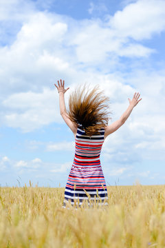 Image of one young pretty lady having fun standing in the field