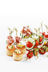 nice set of canapes for one person with vegetables, cheese, fruits, berries, salami, seafood, meat and decoration on white background studio isolated with space for text template - 90863745