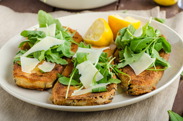 Fried breaded eggplant with salad