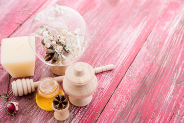 Obraz na płótnie Canvas spa treatment - star anise, honey, salt, arranged with soap bar