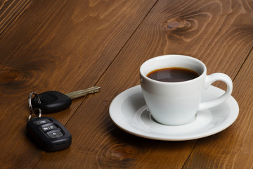 Obraz na płótnie Canvas car keys and coffee cup