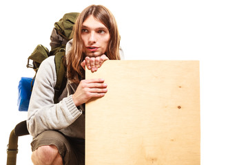 Man hiker backpacker with blank wood copy space ad