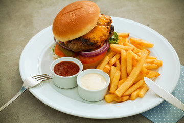 Delicious burger on wooden board,