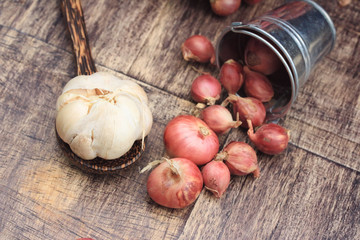 shallots and garlic on wood vintage