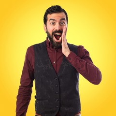 Man wearing waistcoat doing surprise gesture