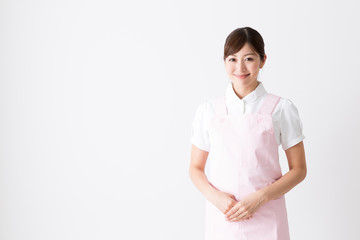 young asian care worker isolated on white background