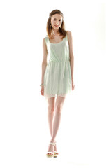 Full body Portrait of a beautiful girl in a light summer dress.