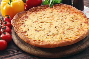 Cheese pizza with vegetables on table close up